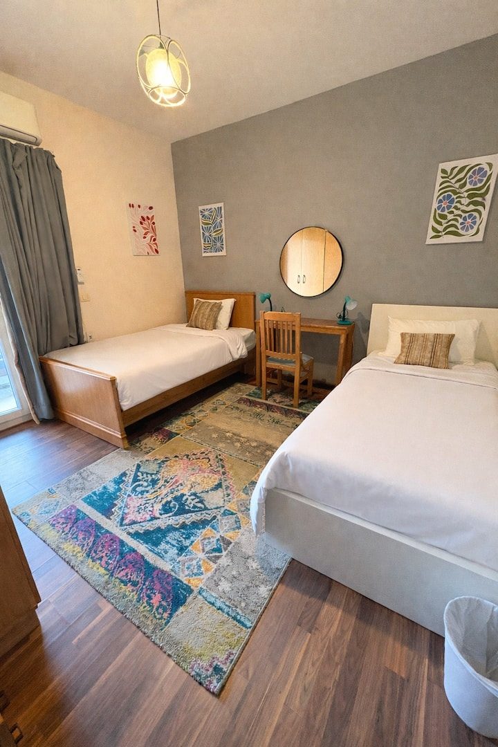 Second bedroom with two single beds and a pull-out third bed