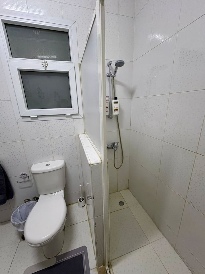 A closer view of the shower and its enclosure