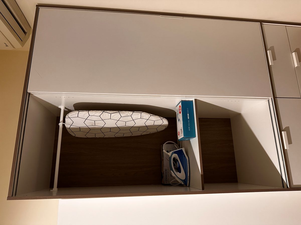 Wardrobe with an iron and ironing board