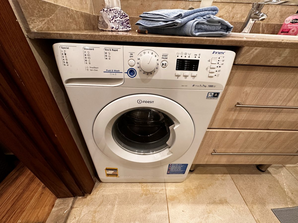 Washing machine with a drying rack beside it