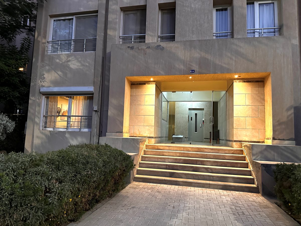 The building entrance with steps leading up to the door