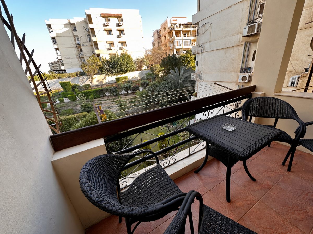 Furnished balcony looking over the compound gardens