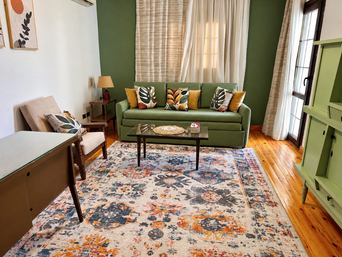 Third bedroom arranged as a daytime lounge, with a desk