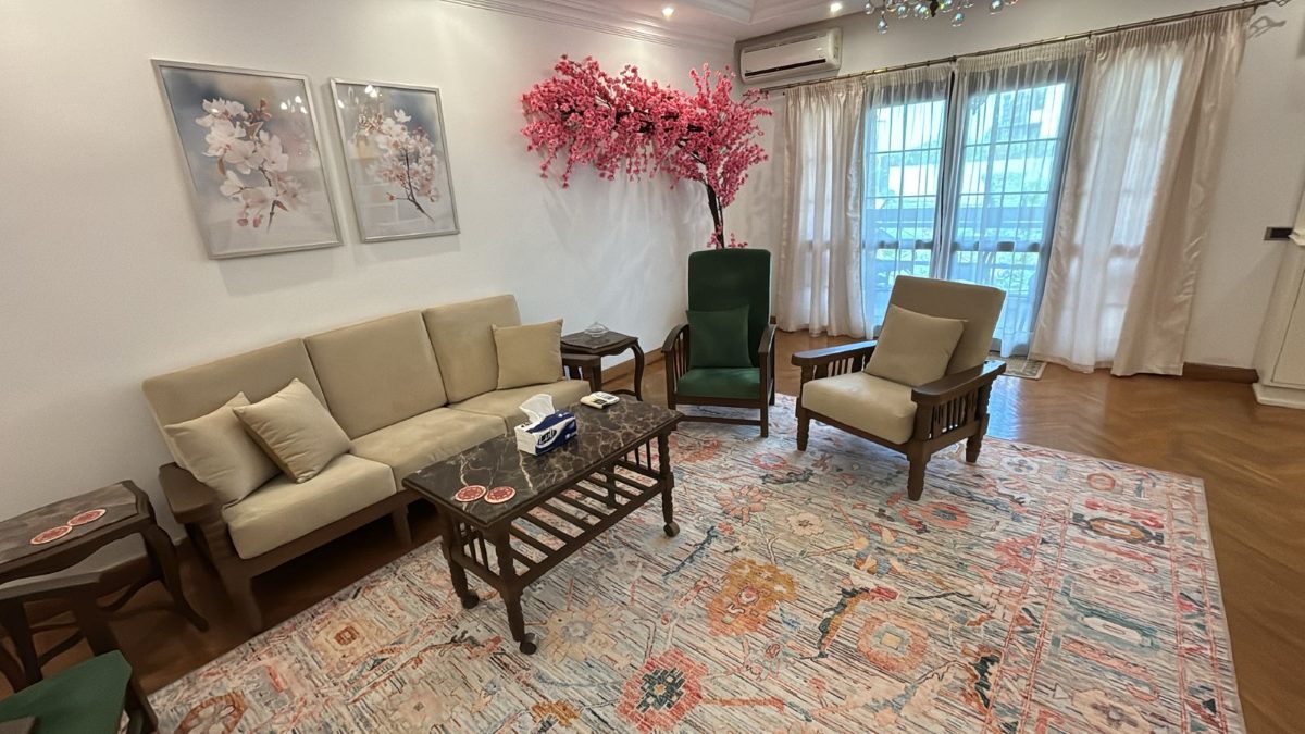 Vintage seating and floral upholstery in the living room