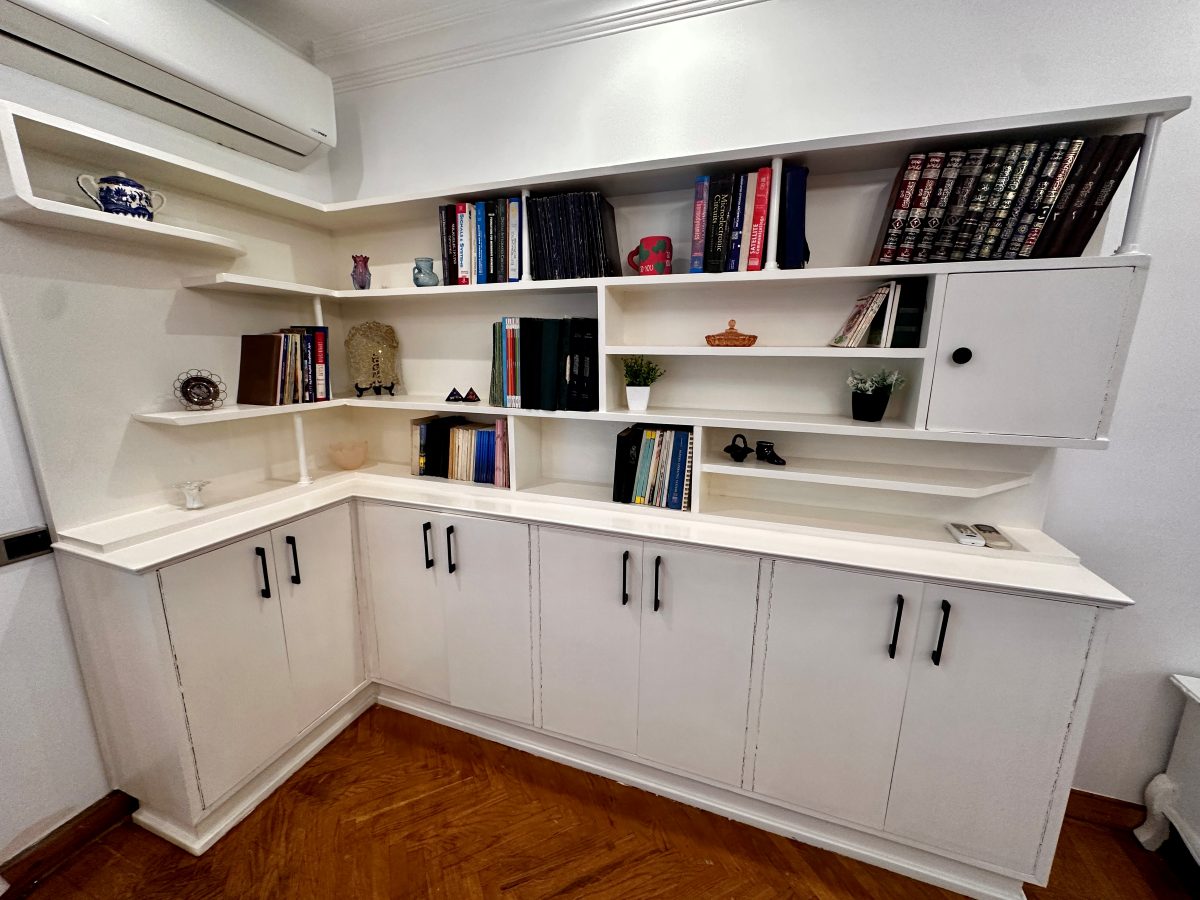 Bookshelves and reading material in the main living room.