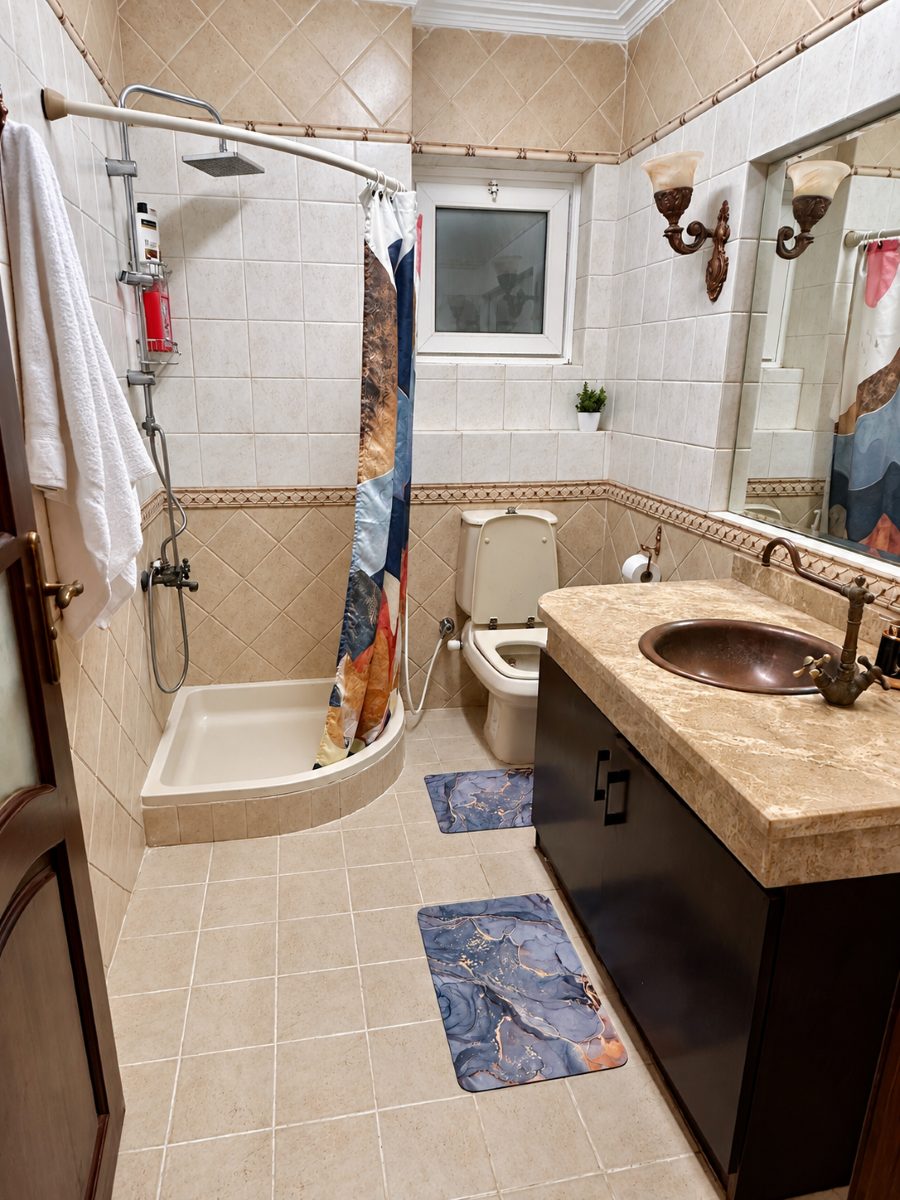Second bathroom with a separate shower area